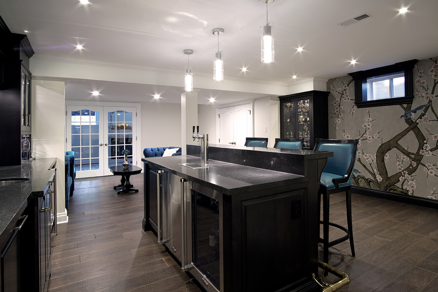 Basement home bar opening to the lounge and garden doors — Burrowhill, Studio Kimi Mississauga