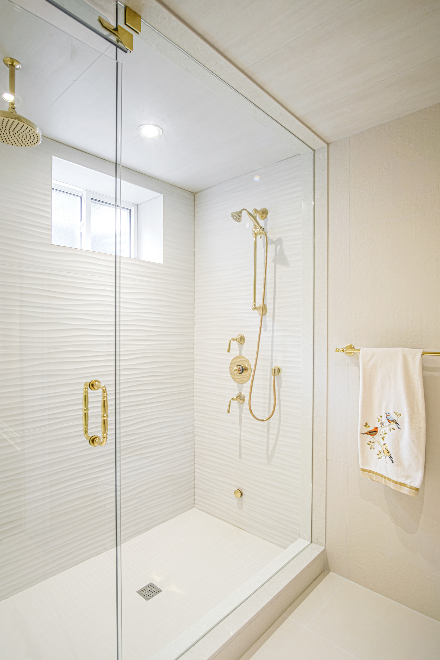 Bathroom with glass shower and marble — Burrowhill basement, Studio Kimi Mississauga