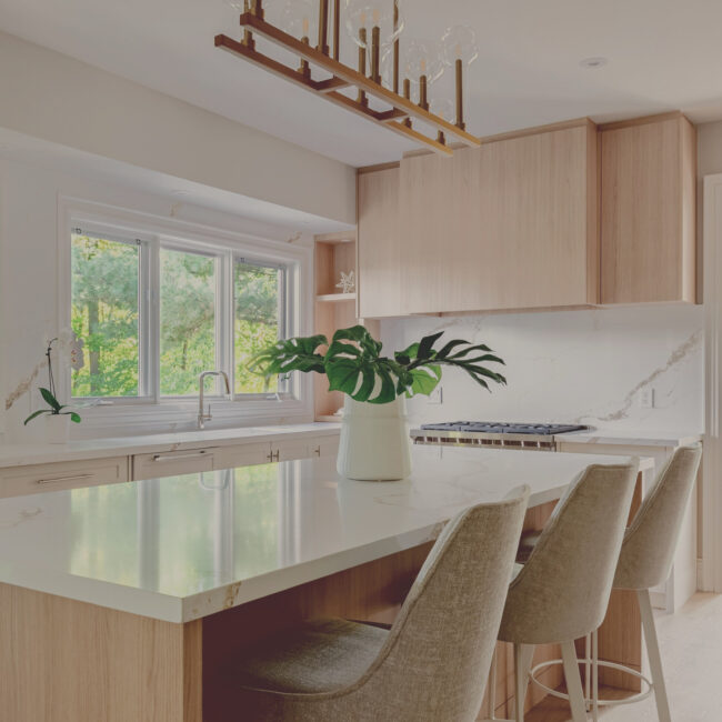 Duncan kitchen island with pendant lights — Studio Kimi interior design in Oakville