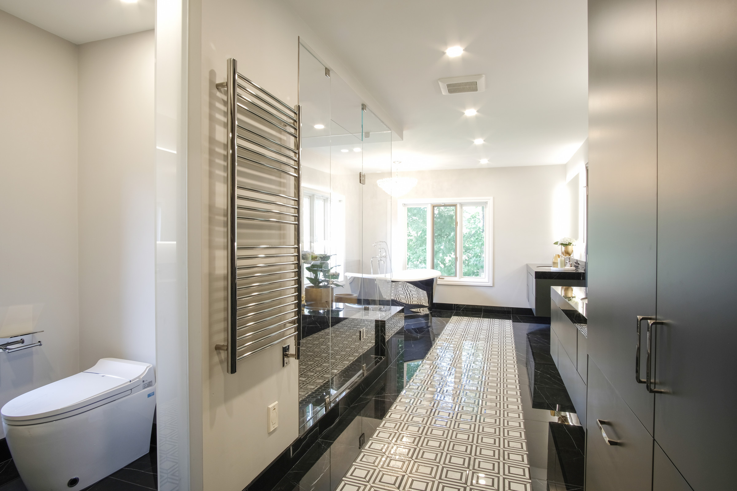 Large primary ensuite with patterned tile floor and glass shower, Lorne Park, Mississauga