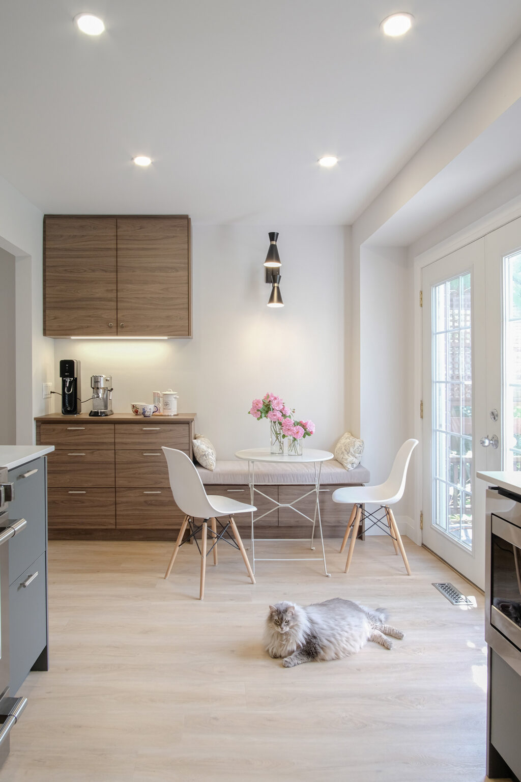 Ingram kitchen opening to the bright breakfast nook — Studio Kimi Mississauga