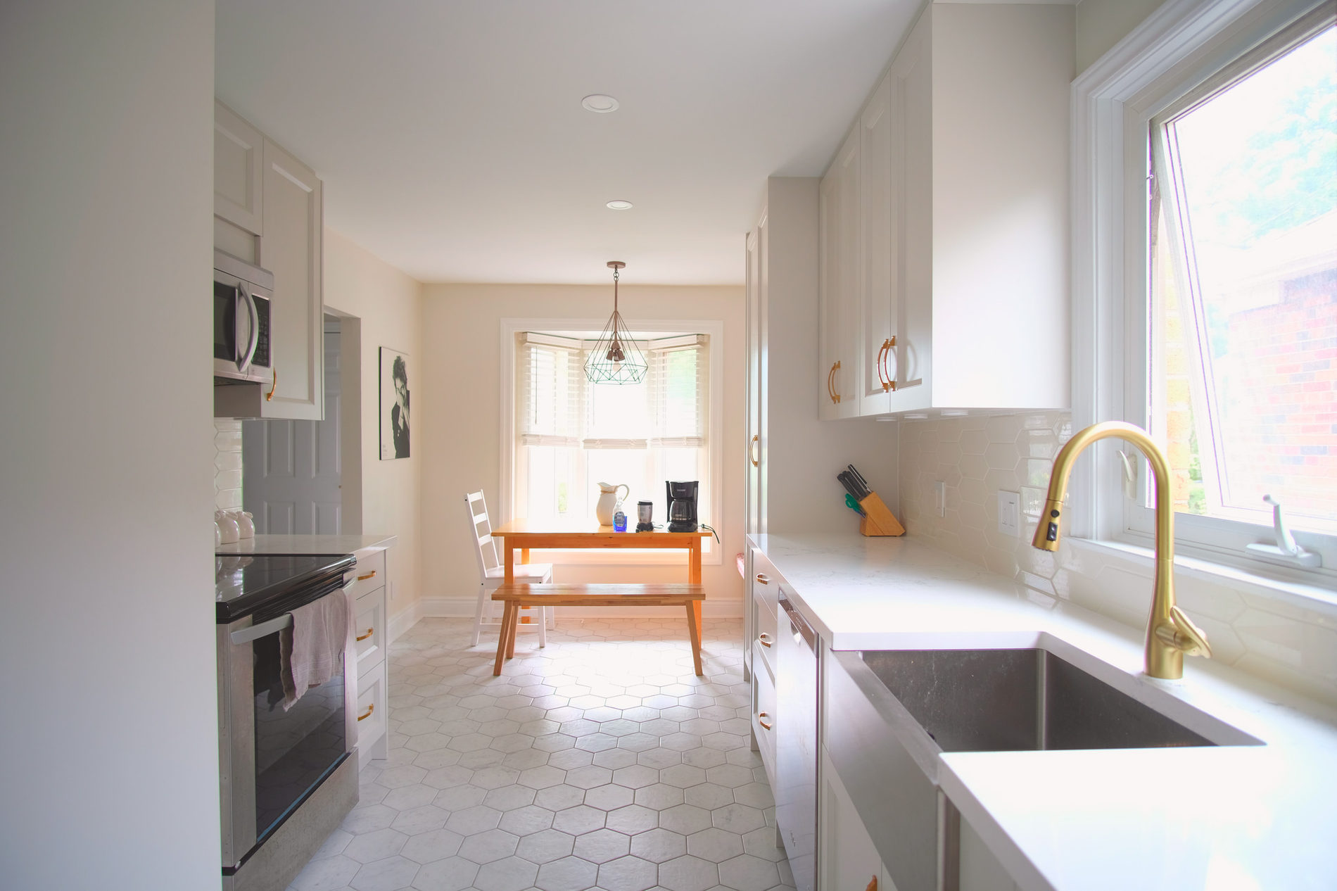 Open kitchen looking through to the dining area in an Etobicoke renovation by Studio Kimi