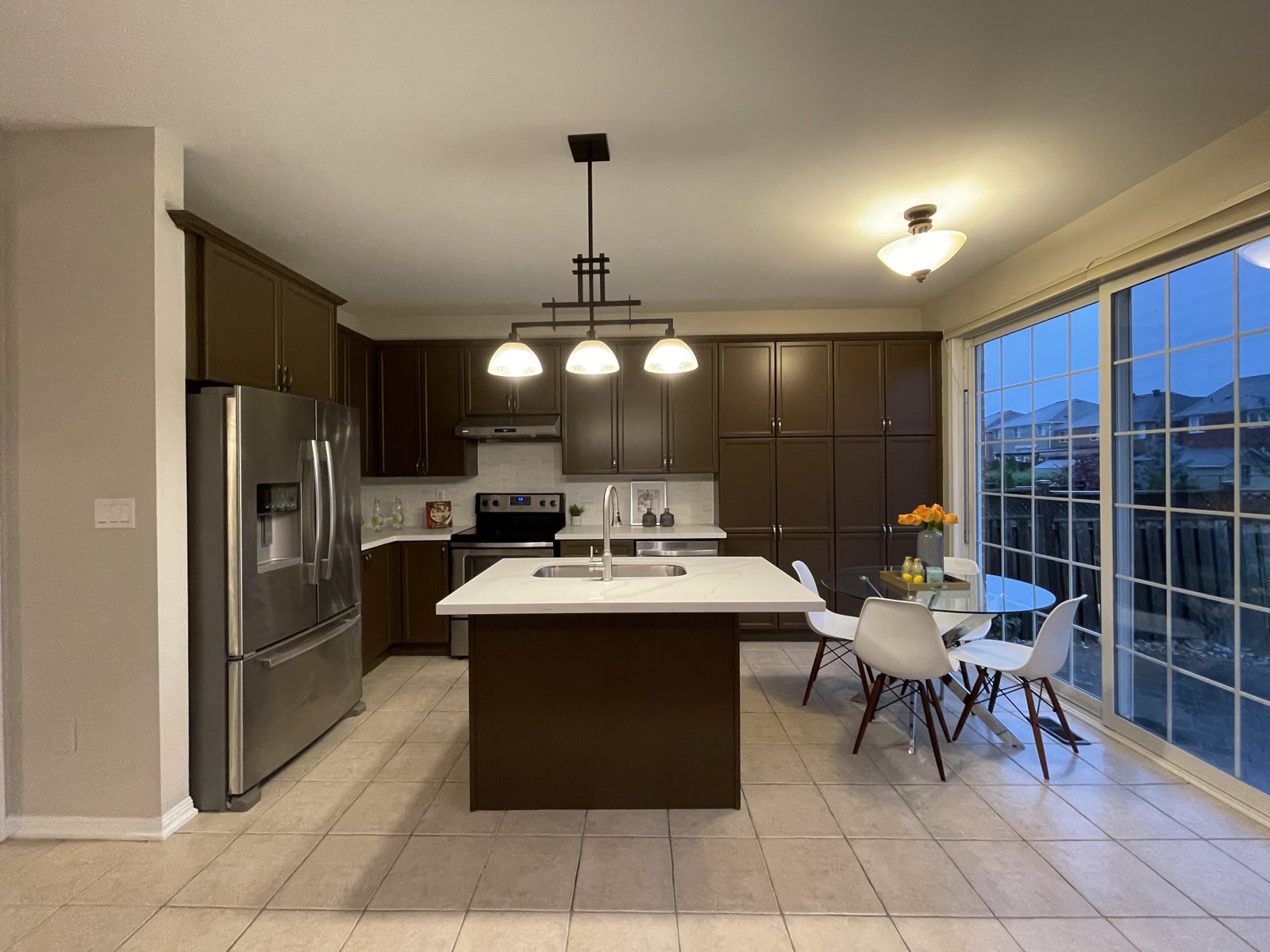 Rosanna kitchen before renovation &mdash; original island and dining area, Mississauga
