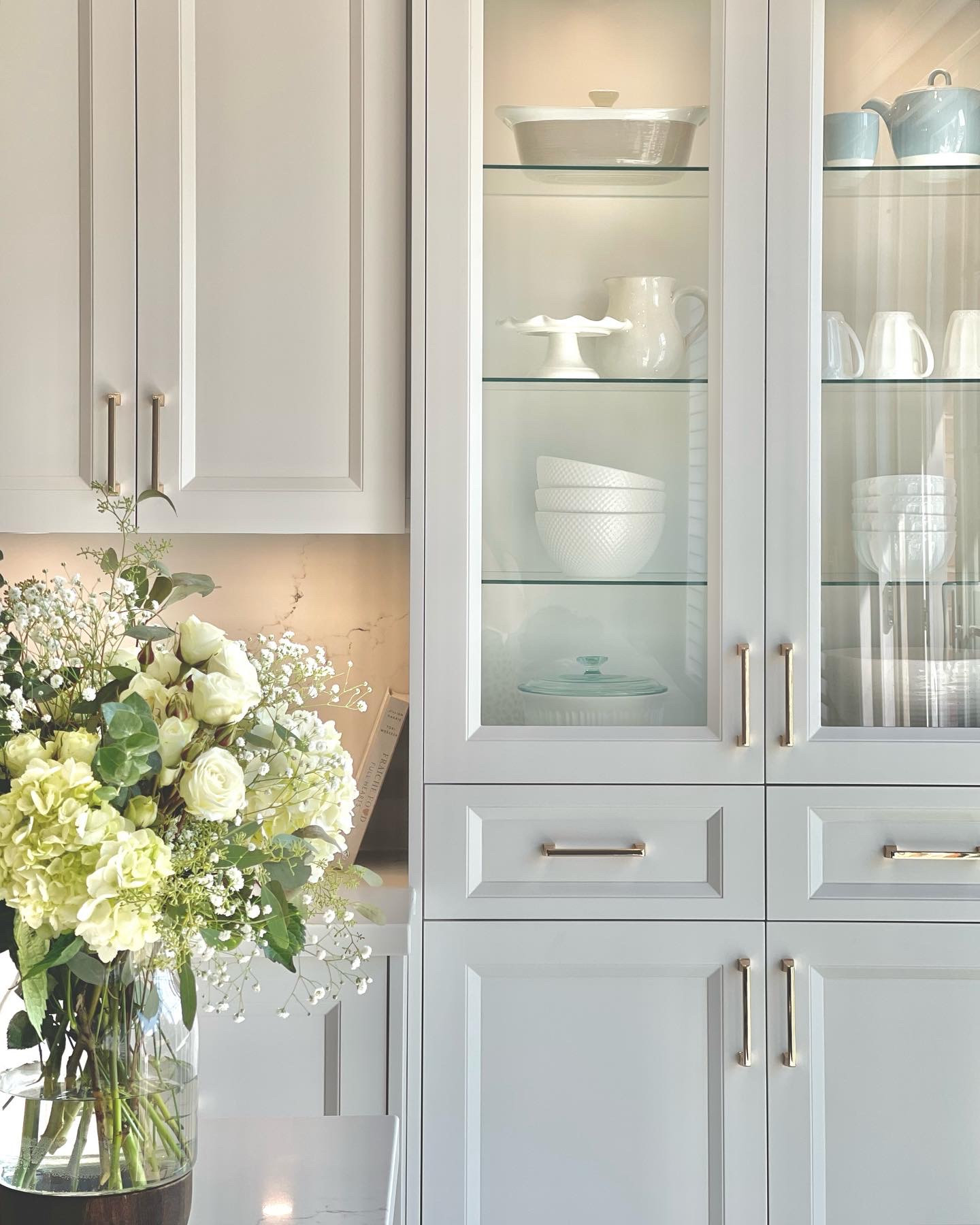 Glass display cabinet styled with flowers, Rosanna kitchen