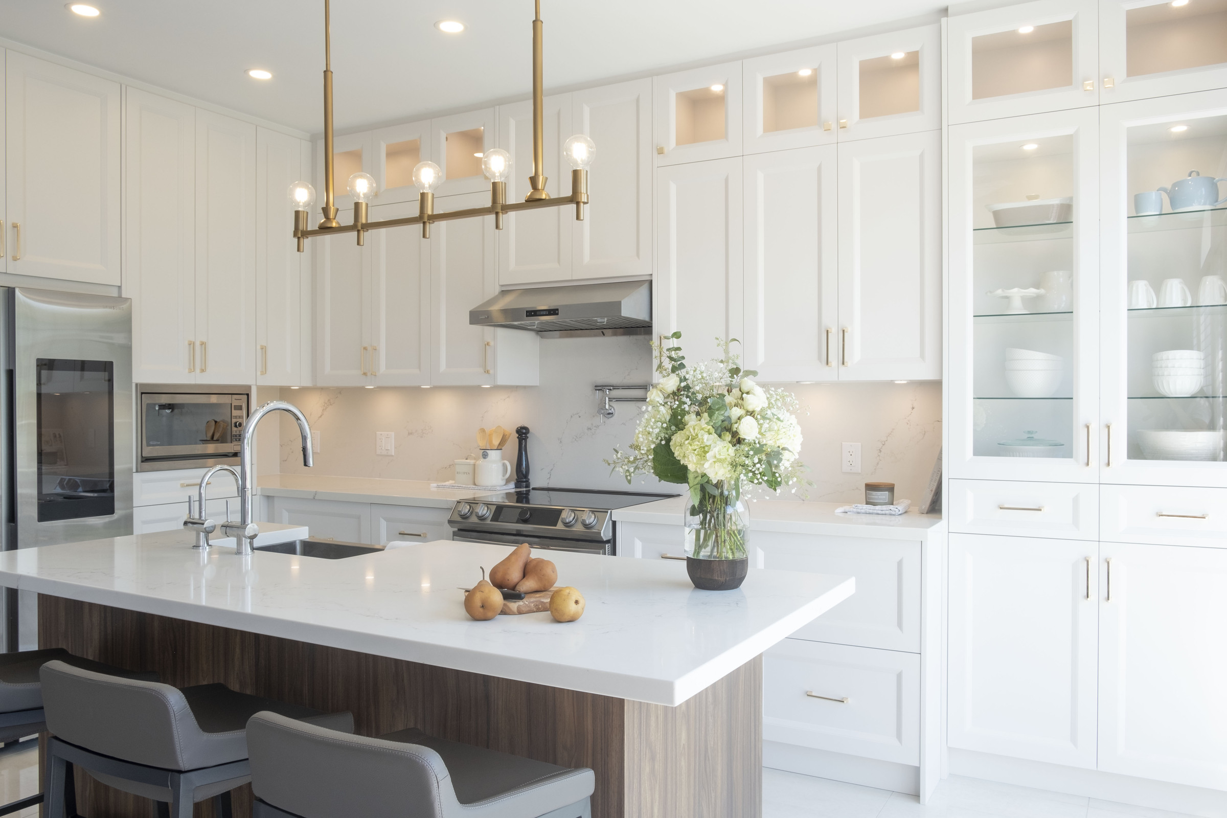 Walnut island with barstools and marble waterfall counter, Rosanna