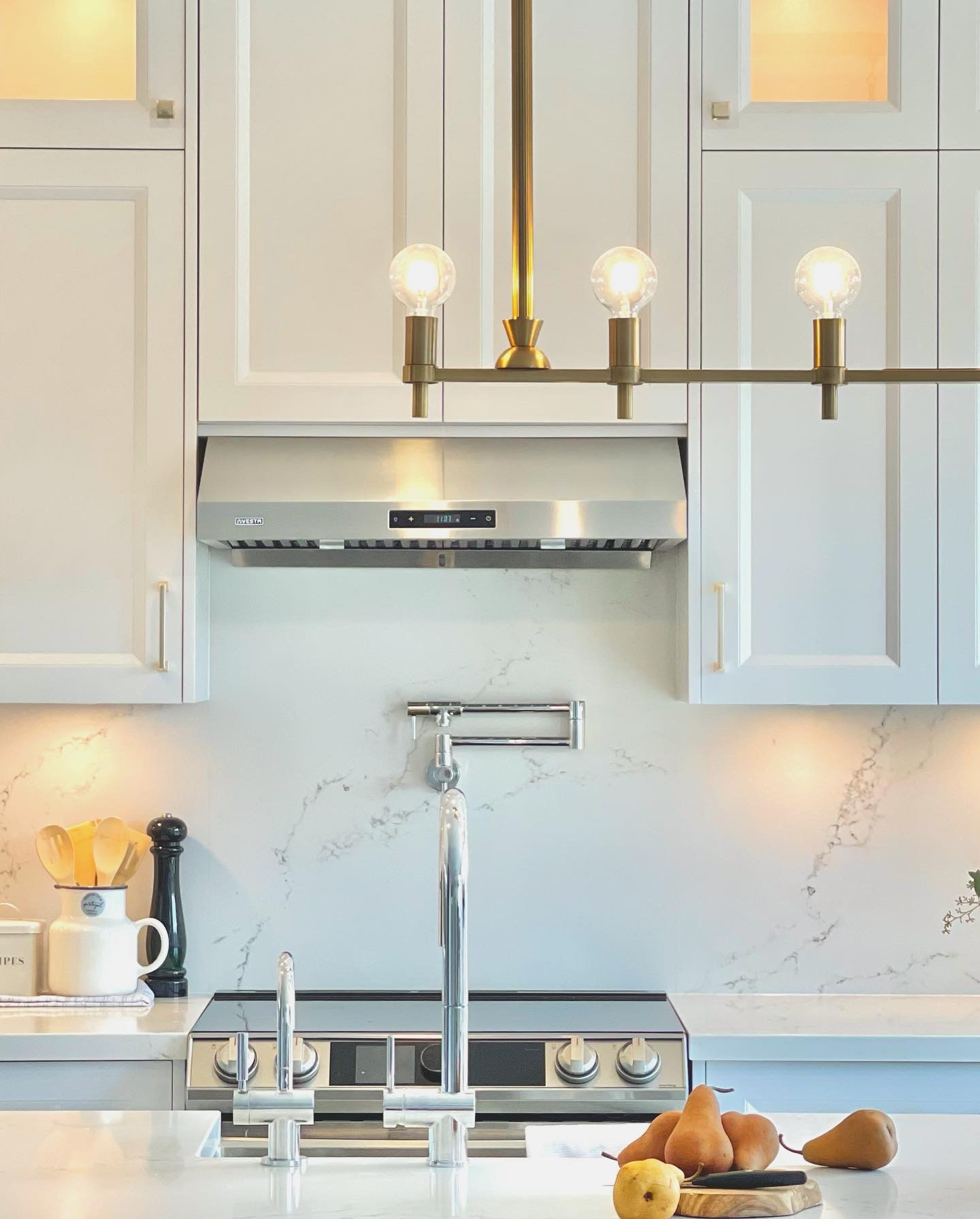 Range with marble slab backsplash and brass hardware, Mississauga kitchen