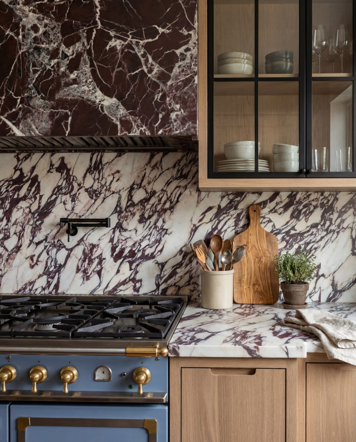 Sixth Lane Calacatta Viola range wall with blue La Cornue range — Studio Kimi interior design in the GTA