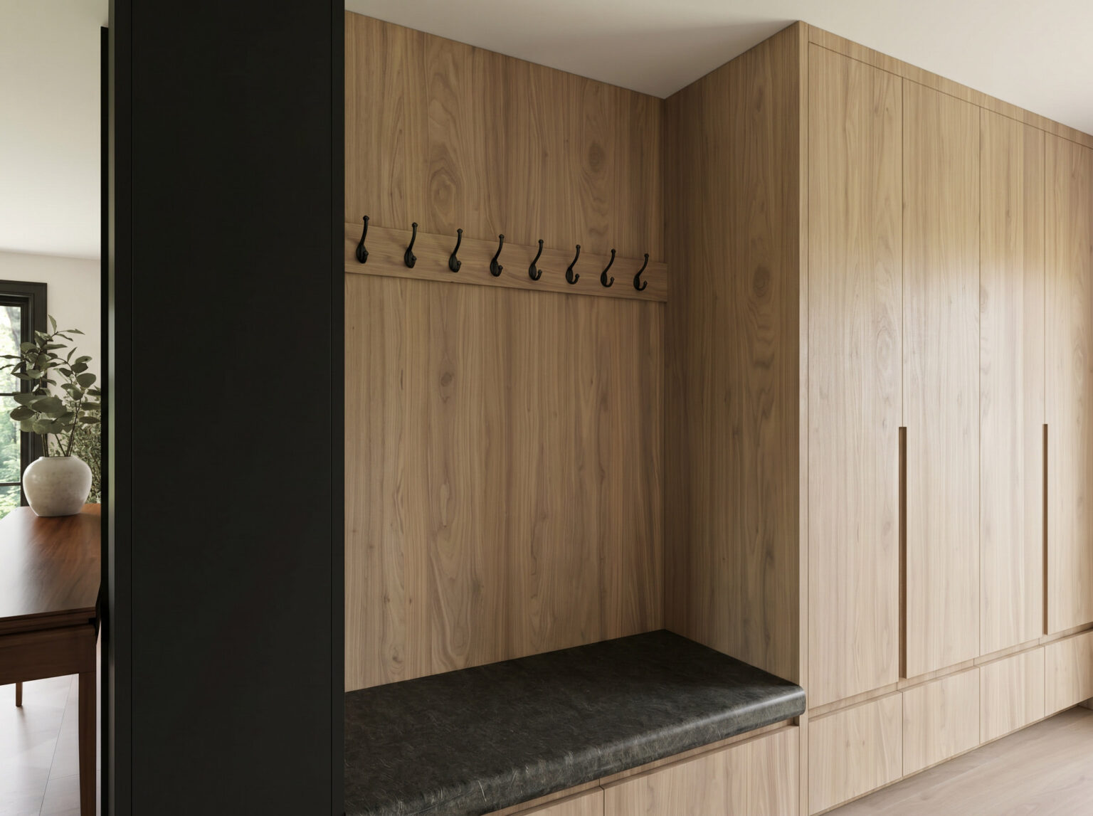 Sixth Lane mudroom with white oak storage and leather bench — Studio Kimi interior design in the GTA