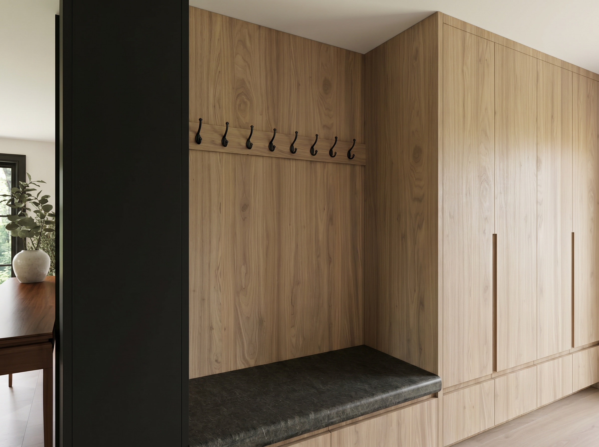 Sixth Lane mudroom with white oak storage and leather bench — Studio Kimi interior design in Milton