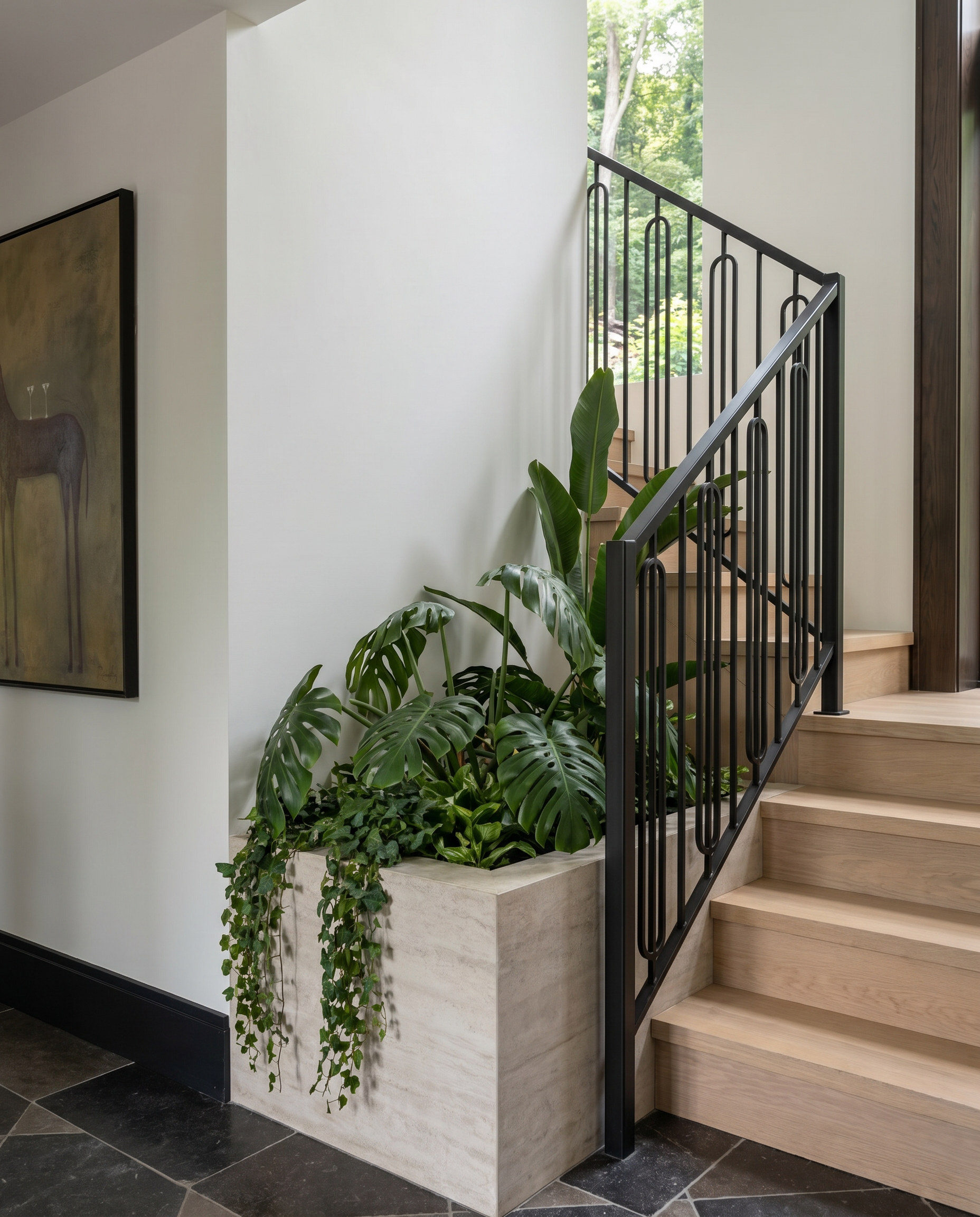 Sixth Lane blackened-steel stair rail and travertine planter — Studio Kimi interior design in Milton