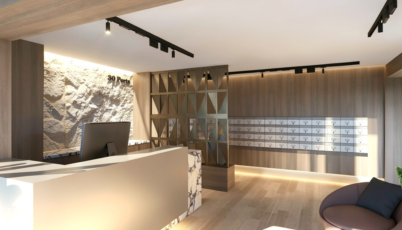 The lobby front desk, backed by a wall of resident mailboxes — Studio Kimi